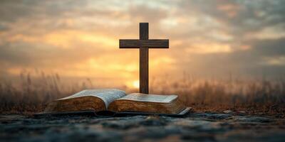 Inspirational moment at sunset with a cross and open Bible in a serene landscape photo