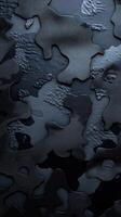 Abstract textured surface with black and grey patterns reflecting light and shadow photo