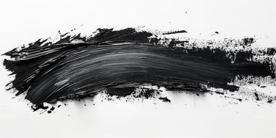 Bold black acrylic paint stroke on a white canvas creating a striking contrast in abstract art composition photo