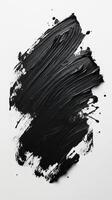 Black paint sweep on a blank canvas showcasing texture and depth in a creative space photo