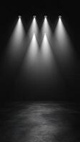 Spotlights illuminate a dark stage in preparation for a performance or event photo