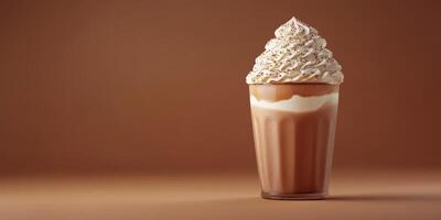 Delicious milkshake topped with whipped cream served in a clear glass against a simple brown background photo