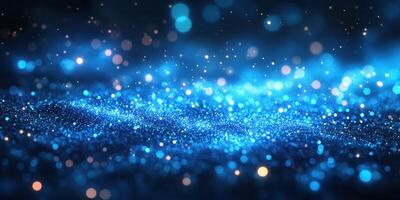 Sparkling blue particles create a mesmerizing effect in a dark setting during an artistic display of light photo