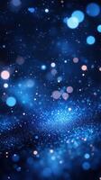 Vibrant blue abstract background with luminous bokeh and sparkling particles at night photo