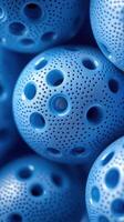 Colorful blue sports balls stacked together, showcasing their unique perforated design and vibrant texture photo