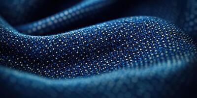 Close-up view of textured blue fabric showcasing intricate weaving patterns and shimmering details under soft light photo