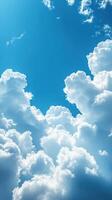 Bright blue sky filled with fluffy white clouds on a sunny day in early afternoon photo