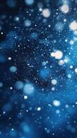Bright and shimmering blue particles create a magical atmosphere with depth and texture in this enchanting background photo
