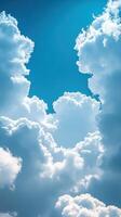 Beautiful white clouds forming intricate patterns against a bright blue sky photo