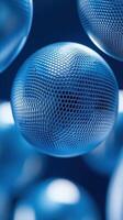 Blue metallic spheres with geometric patterns floating in space create a futuristic atmosphere photo