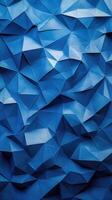 Intricate origami-like blue paper texture with sharp edges and folds, creating a dynamic visual effect photo