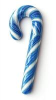 Decorative blue and white candy cane resting on a plain background for holiday season decoration or culinary display photo
