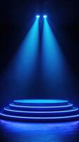 Stage illuminated by blue lights with focused beams highlighting its structure and ambiance for a performance photo