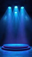 Bright blue stage lights illuminating a circular platform in a darkened space for a performance or event photo