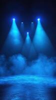 Dramatic blue stage lighting with fog created for a performance setting at night photo