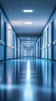 Long, brightly lit hospital corridor with blue walls and shiny floors in a modern medical facility photo