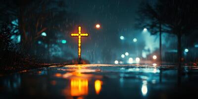 Nighttime street illuminated by glowing cross under rainy weather near a city intersection photo