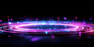 Colorful abstract light rings with shimmering particles against a dark background photo
