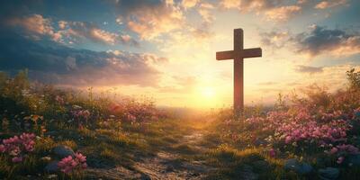 Cross in a flower-filled meadow at sunrise under a beautiful sky with colorful clouds photo