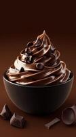 Rich chocolate soft serve dessert presented in a black bowl against a smooth dark background photo