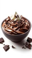 Creamy chocolate dessert topped with whipped cream and chocolate shavings served in a black bowl photo