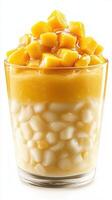 Delicious mango dessert layered with coconut and sweetened rice served in a glass photo