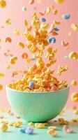Colorful cereal pieces cascade into a turquoise bowl against a pastel backdrop photo