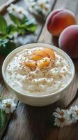 Creamy yogurt bowl topped with fresh peaches and crunchy granola in a rustic setting photo