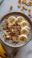 Healthy breakfast bowl featuring chia seeds, oats, and fresh banana slices for a nutritious start to the day photo