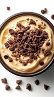 Creamy dessert topped with chocolate chips in a bowl ready to be enjoyed at a cozy kitchen setting photo