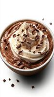 Chocolate dessert with whipped cream and chocolate shavings in a bowl on a white surface photo