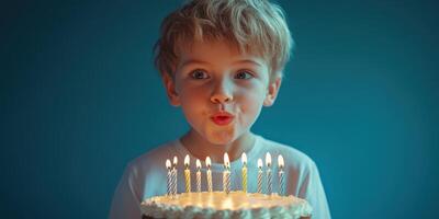 Boy blows out birthday candles on a decorated cake during joyful celebration at home photo