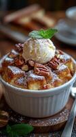Delicious bread pudding topped with whipped cream and nuts served in a cozy restaurant photo