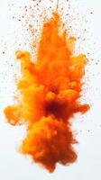 Bright orange powder explosion creating a vibrant cloud against a white background photo