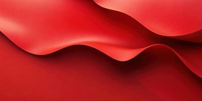 Red fabric drapes flowing elegantly across a surface with soft curves and folds creating a dynamic visual texture photo