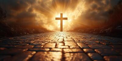 Sunrise over a pathway leading to a cross illuminated by golden light in a serene landscape photo