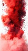 Bright red and dark clouds of powder create a dramatic artistic effect in the air photo