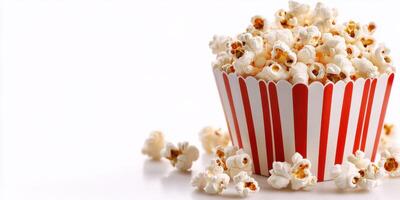 Popcorn in striped cup, scattered kernels on white surface, perfect for movie nights and gatherings, evoking a sense of nostalgia and fun photo