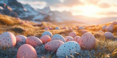 Colorful eggs scattered across a meadow at sunset with mountains in the background photo
