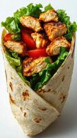 Grilled chicken wrap with fresh vegetables served on a white background photo