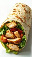 Fresh chicken wrap prepared with crisp lettuce and ripe tomatoes, showcasing a flavorful meal for lunch or dinner photo