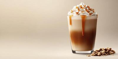 Creamy caramel latte topped with whipped cream and drizzled with syrup served in a glass with crushed cookies photo