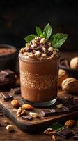 Rich chocolate smoothie topped with nuts and mint leaves in a rustic kitchen setting during evening light photo