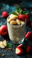Healthy chia seed pudding topped with fresh apples and raspberries on a dark background photo