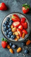 Delicious chia seed pudding topped with fresh strawberries, blueberries, and almonds for a nutritious snack photo