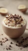 Delicious dessert with whipped cream and chocolate shavings served in a textured bowl for an elegant sweet treat photo