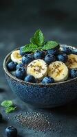 Delicious smoothie bowl topped with fresh blueberries, banana slices, and chia seeds for a nutritious breakfast option photo