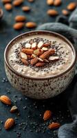Delicious bowl of almond chia pudding topped with sliced almonds and chia seeds photo