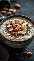 Healthy bowl of oatmeal topped with almonds and chia seeds in a cozy kitchen setting photo