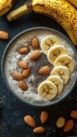 Creamy oatmeal bowl topped with bananas and almonds, perfect for a nutritious breakfast at home photo